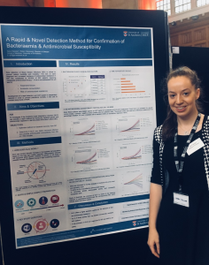 Kerry Falconer presenting her poster at a conference